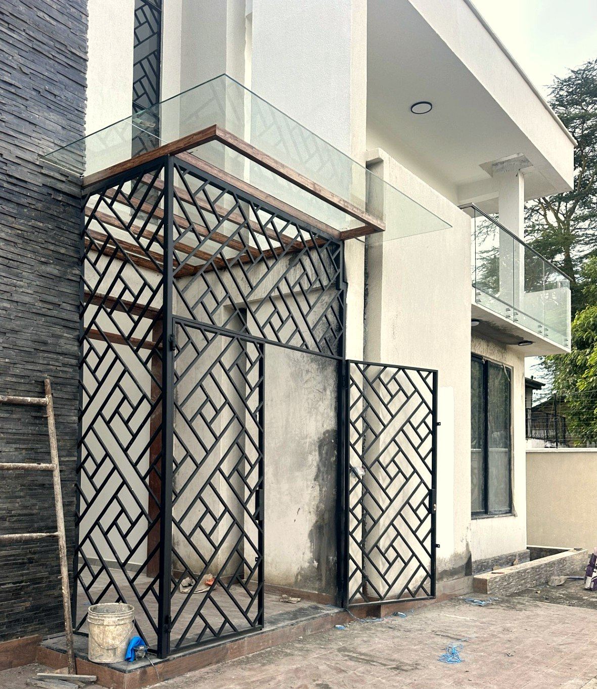 Geometric steel entrance grill and canopy