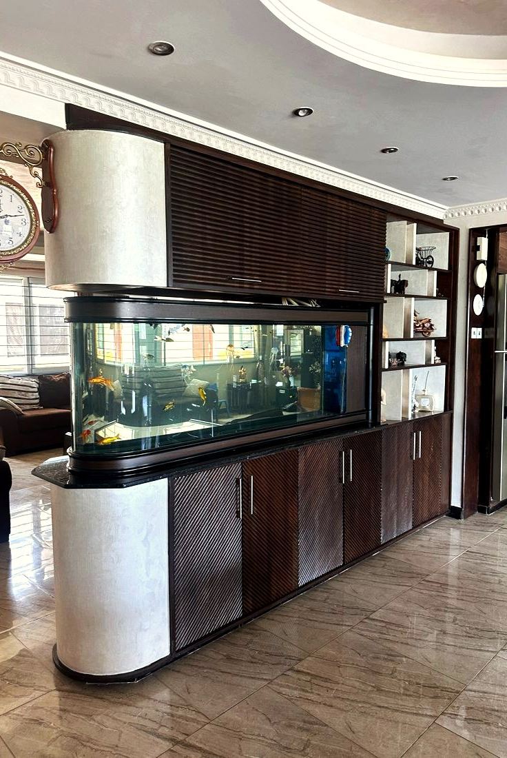 Hotel buffet counter with aquarium and dark timber joinery